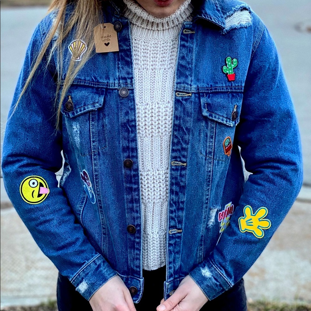 Denim jacket with sewed on patches